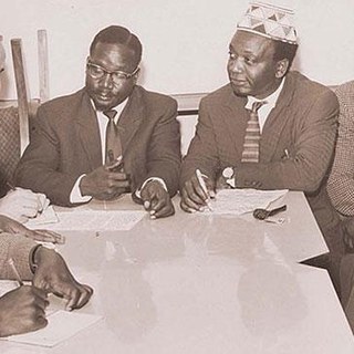 KADU leaders on the day they dissolved their opposition party to join the governing KANU in 1964. They are led by Masinde Muliro,centre left and Ronald Ngala,centre right.