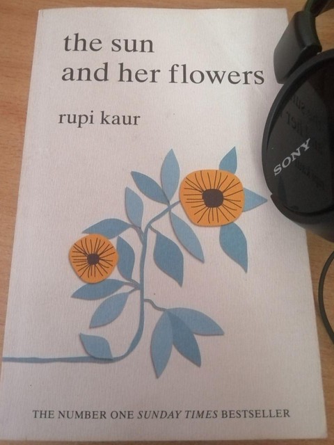 Rupi Kaur Sun and her flowers